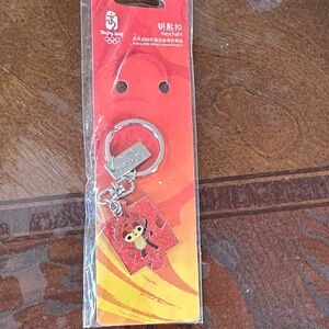 Red Keychain with Puzzle Piece Design